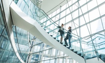 Employee standing on stairs and talking