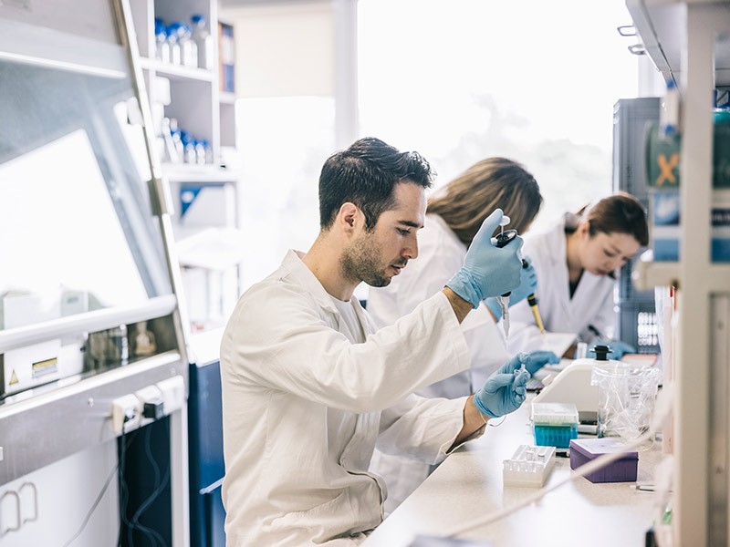 Scientist of life science industry performing some testing in lab