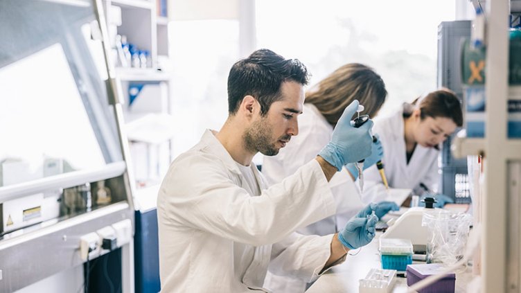 Scientist of life science industry performing some testing in lab