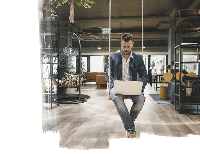 Man in office on swing