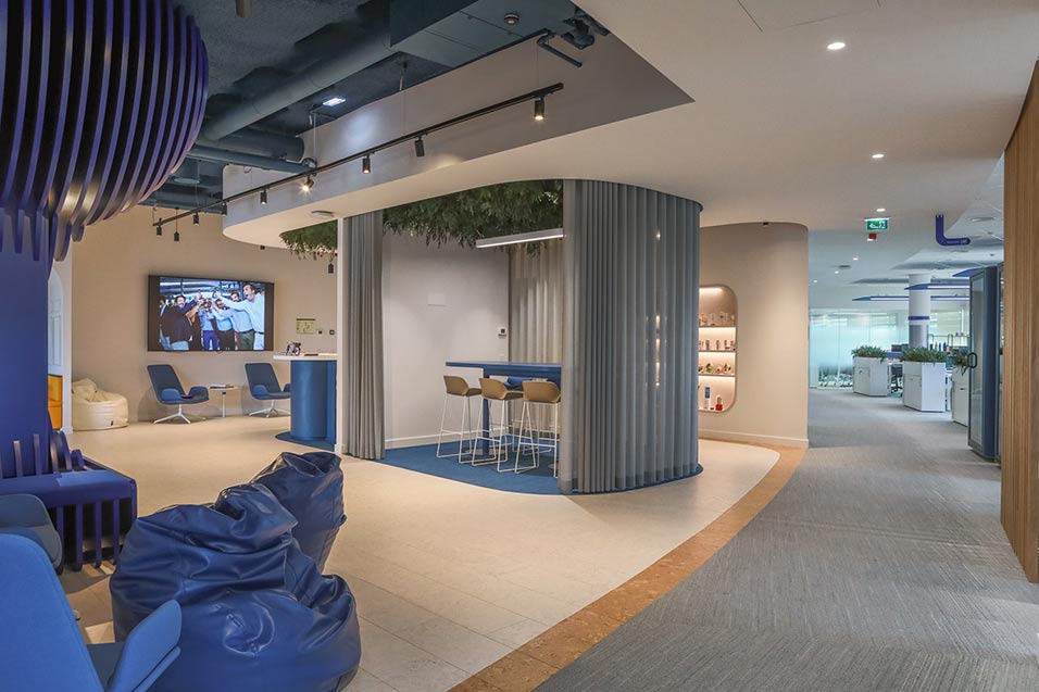 A modern office interior featuring blue furniture, creating a professional and inviting workspace atmosphere.