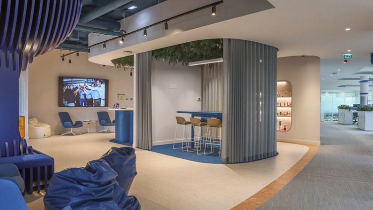 A modern office interior featuring blue furniture, creating a professional and inviting workspace atmosphere.