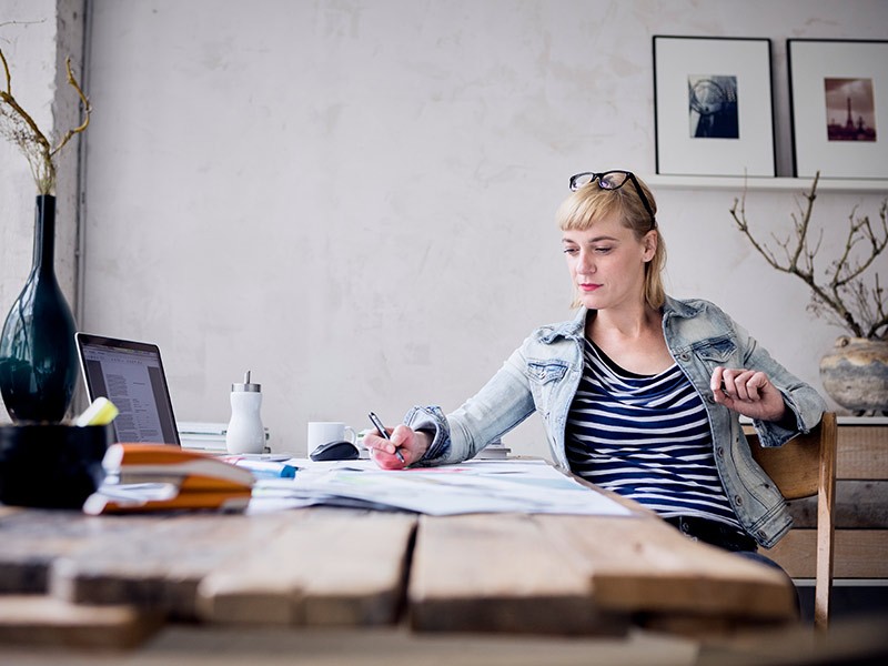 Women writing in a note