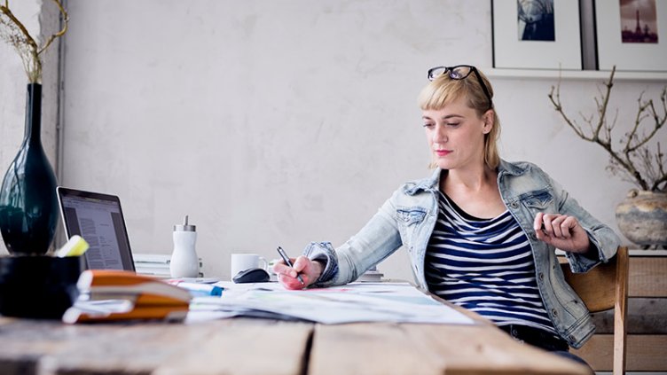 Women writing in a note