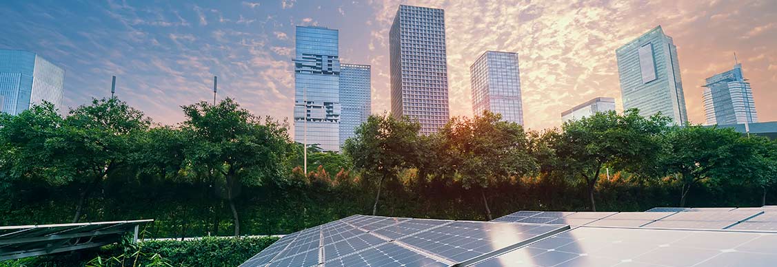 Solar Power Plant in modern city in sunset