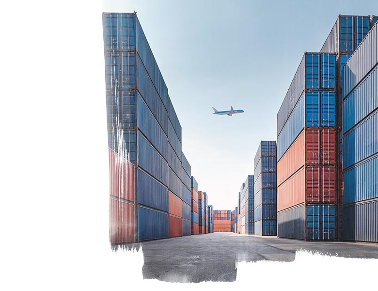 An airplane above a port with containers