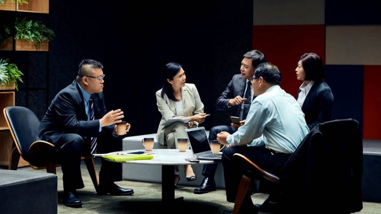 people discussing in office