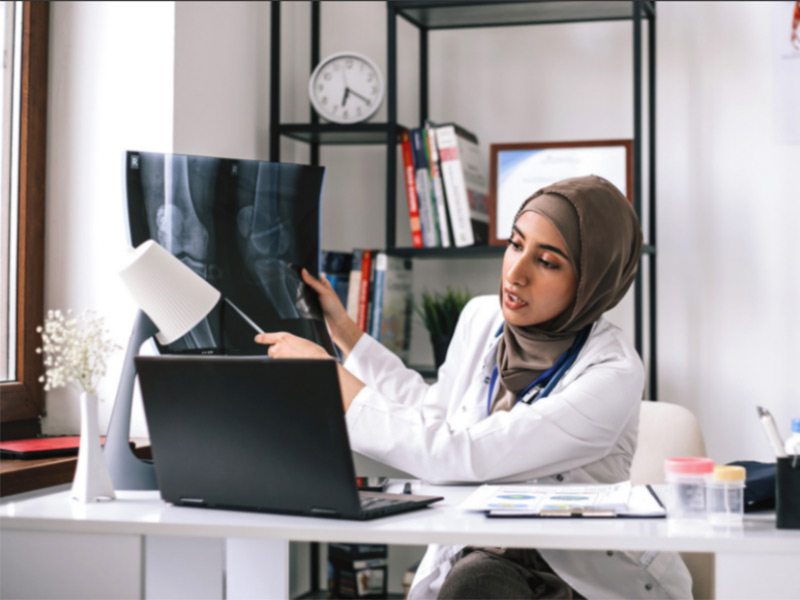 Employee is talking with someone on laptop